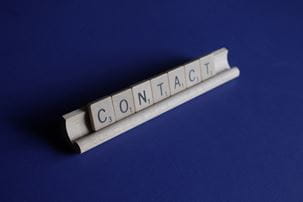 Scrabble tiles spelling the word contact