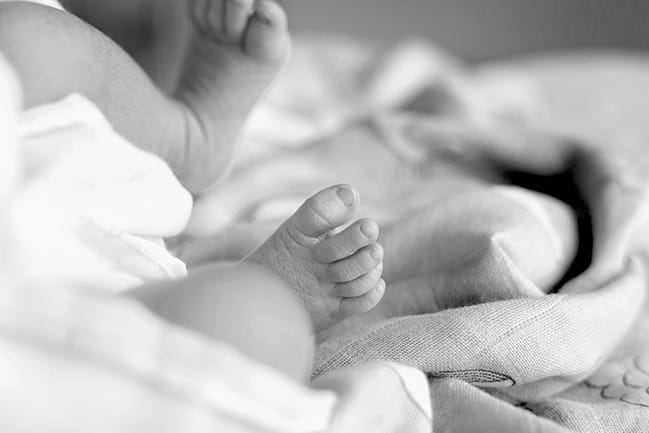 Black and white photo of baby's feet