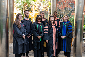 Group shot of faculty and graduates at commencement