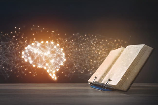 brain made of light reading a book