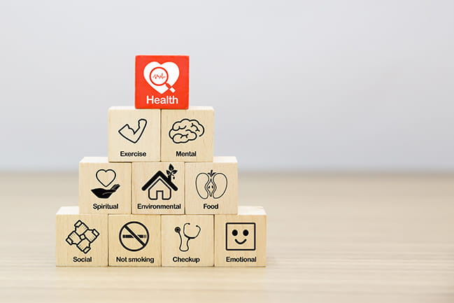 Health promotion Graphic Icon on Wooden block.