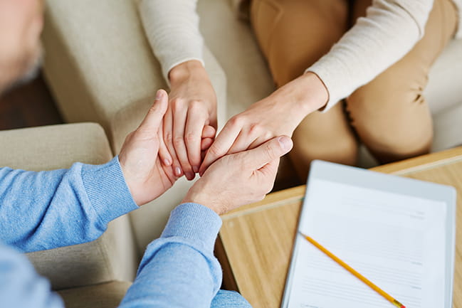 Close-up of Caucasian female hands in those of Caucasian man