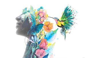 Photo of woman's face with watercolor of flowers and hummingbird