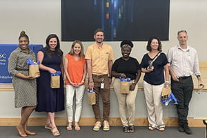 Group of state employees receiving an Outstanding Service to Interprofessional Education award