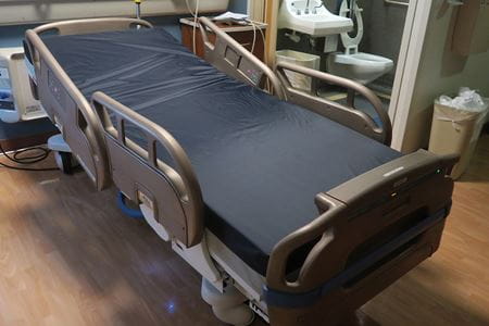 Hospital bed retrofitted with copper coating