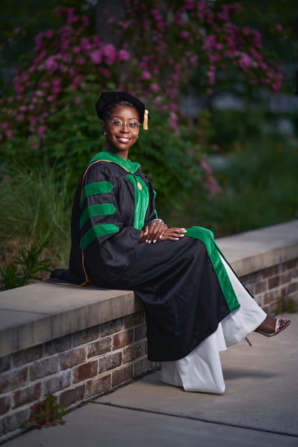 Ka'la Drayton poses in her graduation regalia