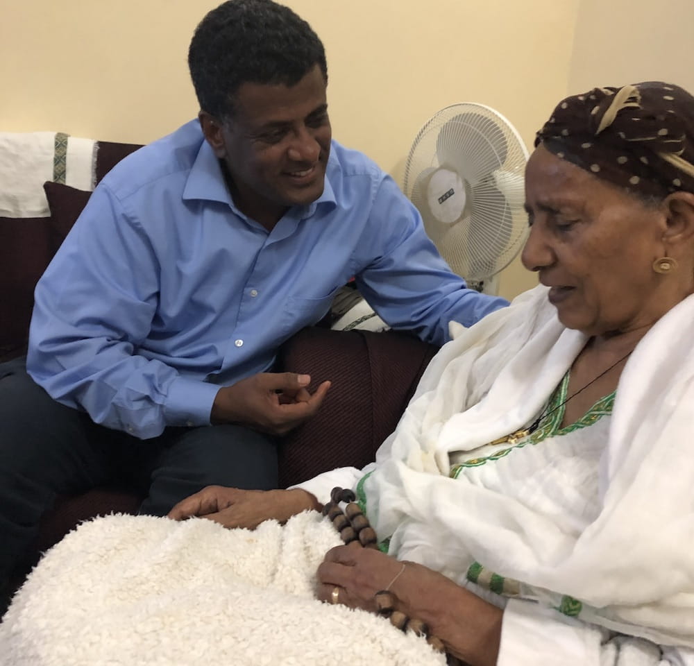 Dr G sitting with his mother