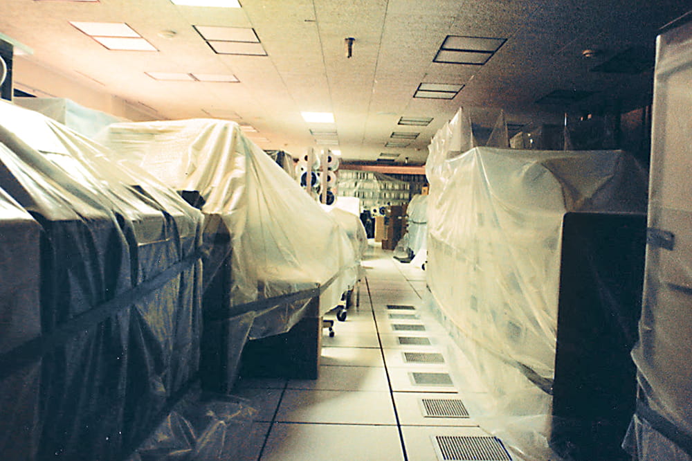 a room filled with oversized computers covered in plastic