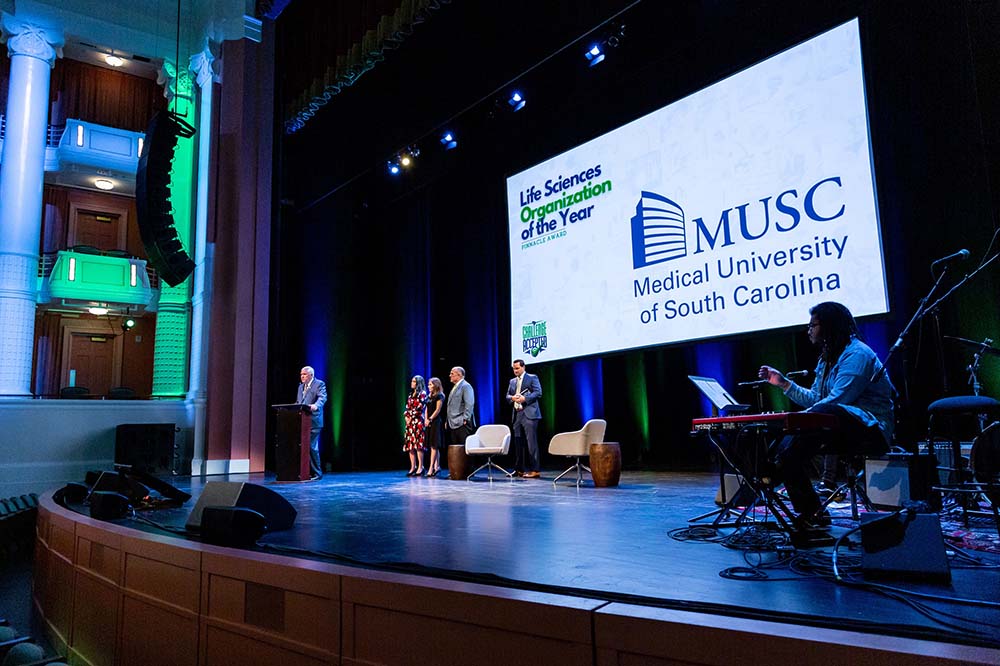 MUSC President David Cole, far left, speaks at the SCBIO Conference at Charleston's Gaillard Center