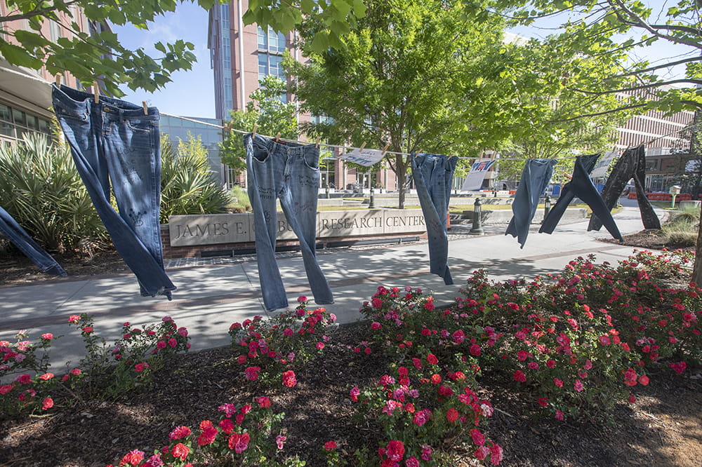 a clothesline with jeans hanging from it on the MUSC campus
