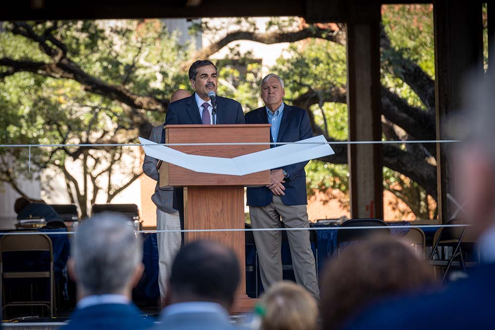 Man stands at a podium.